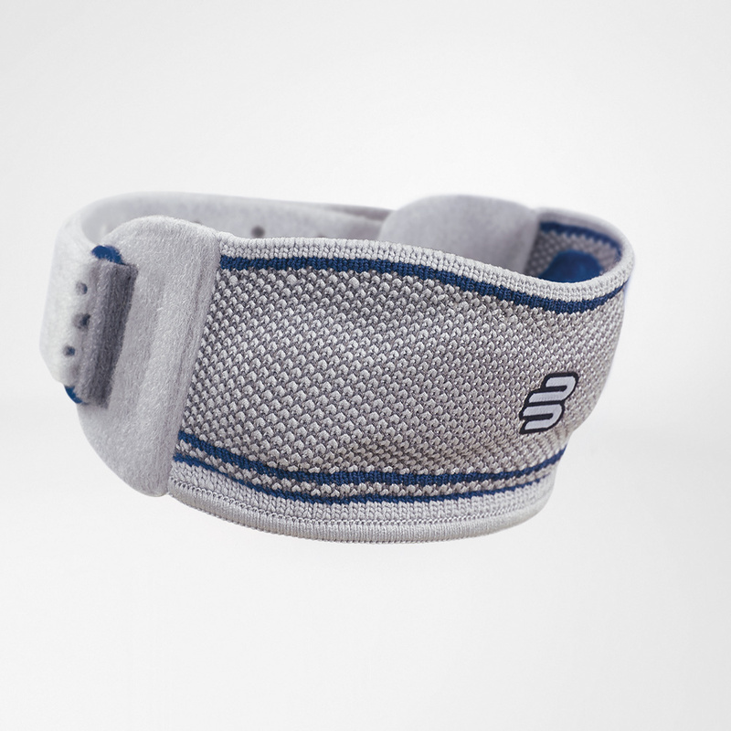 Close-up van GenuPoint knieband met geïntegreerde massagepelotte voor gerichte patellasteun.